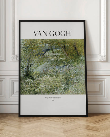 A framed poster of Vincent van Gogh's painting, 'River Bank in Springtime'. The impressionist artwork depicts a lush green landscape with a river and a stone bridge, painted with visible, textured brushstrokes. The title and artist's name are printed on a white border. Artwork