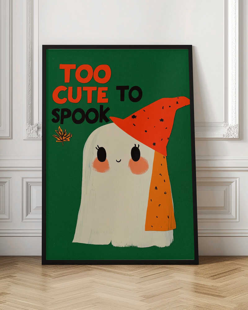 A whimsical illustration of a friendly white ghost with rosy cheeks and a smiling face, wearing a pointy orange hat with black flecks. The background is a solid dark green, and above the ghost, the text 'TOO CUTE TO SPOOK' is written in orange and black block letters, next to a small autumn leaf. Artwork