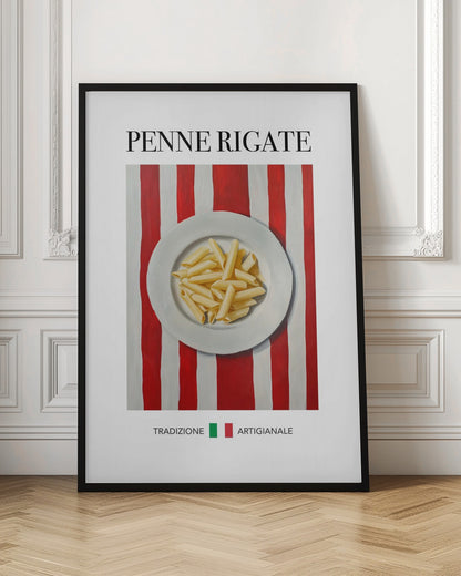 A framed art print featuring a painted illustration of a white plate of penne rigate pasta. The plate is centered on a background of bold red and white vertical stripes. At the top, the words 'PENNE RIGATE' are printed in a black serif font. At the bottom, the Italian words 'TRADIZIONE' and 'ARTIGIANALE' are shown with small green and red squares, evoking the Italian flag. Artwork