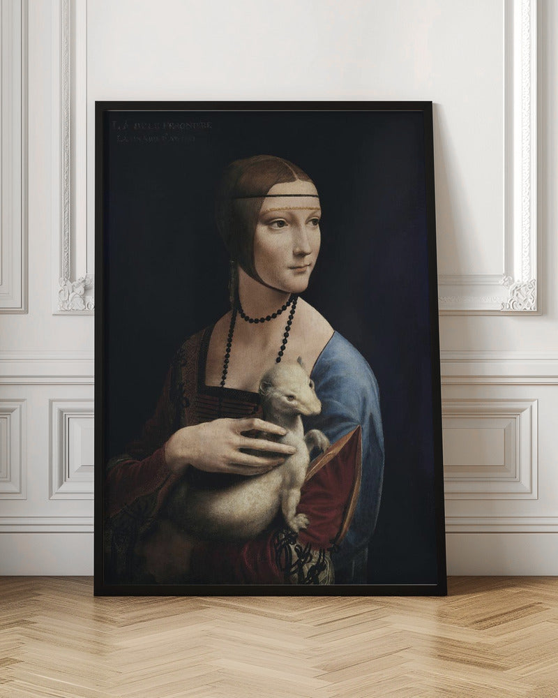A classic portrait painting by Leonardo da Vinci, 'Lady with an Ermine,' in a thin black frame. The painting shows a woman in Renaissance attire with her hair pulled back, holding a white ermine against a dark, plain background. She is turned three-quarters and looks off to the side. Artwork