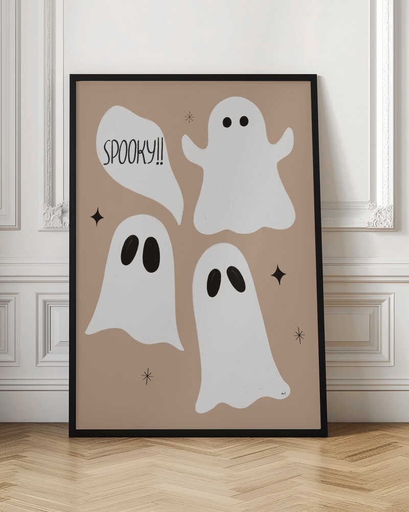 A playful illustration for Halloween featuring three cute, cartoonish white ghosts with black eyes against a solid light brown background. One ghost is accompanied by a speech bubble that reads 'SPOOKY!!' in a hand-drawn font. Small black stars and asterisks are scattered around the ghosts. The artwork is enclosed in a thin black frame. Decor