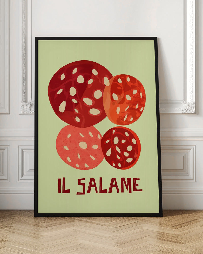 A vintage-style graphic art print of four overlapping slices of salami against a pale green background. The Italian words 'IL SALAME' are printed below in a dark, stylized font. The artwork is enclosed in a black frame. Poster