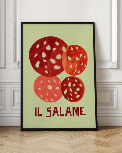 A vintage-style graphic art print of four overlapping slices of salami against a pale green background. The Italian words 'IL SALAME' are printed below in a dark, stylized font. The artwork is enclosed in a black frame. Poster