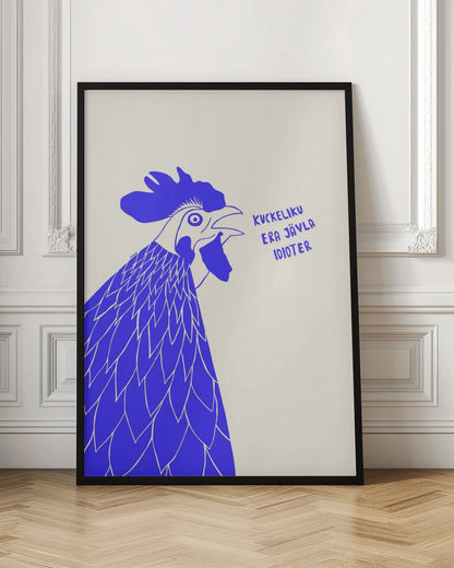 A graphic illustration of a rooster in profile, rendered in bold blue and white against a cream-colored background. The rooster has its beak open as if crowing, and next to it is the phrase in Swedish: 'KUCKELIKU ERA JÄVLA IDIOTER'. The image is shown within a black frame. Poster