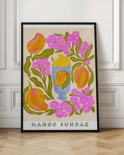 A colorful, stylized art print featuring a central blue glass filled with a yellow mango sundae. The glass is surrounded by lush orange mangoes, vibrant pink flowers with yellow centers, and dark green leaves on a cream-colored background. At the bottom, the words 'MANGO SUNDAE' are written in a bold, block font. Poster
