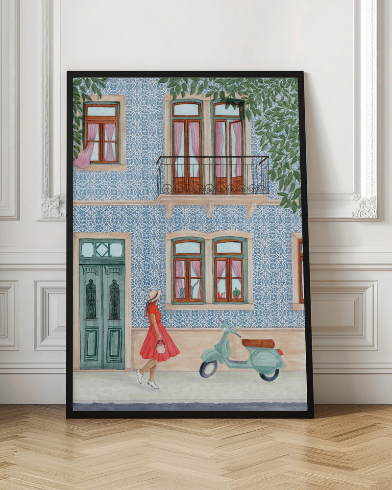 A watercolor illustration of a woman in a red dress and sun hat walking past a building with a blue and white patterned tile facade. A light green scooter is parked on the sidewalk, and the building features wooden windows with pink curtains, a teal door, and a second-story balcony. Print