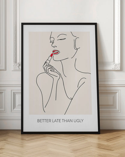 A minimalist line art poster of a woman with her eyes closed, applying bright red lipstick. The artwork is primarily black line on a beige background, with the red lipstick being the only spot of color. Below the image is the text 'BETTER LATE THAN UGLY' in a black sans-serif font. The poster is shown in a black frame. Print