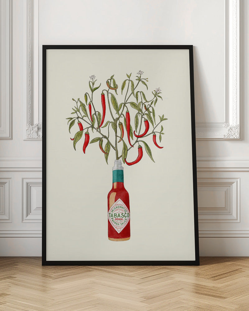 A framed vintage-style illustration of a red chili pepper plant, complete with leaves and blossoms, growing out of the top of a Tabasco brand hot sauce bottle against a cream background. Artwork