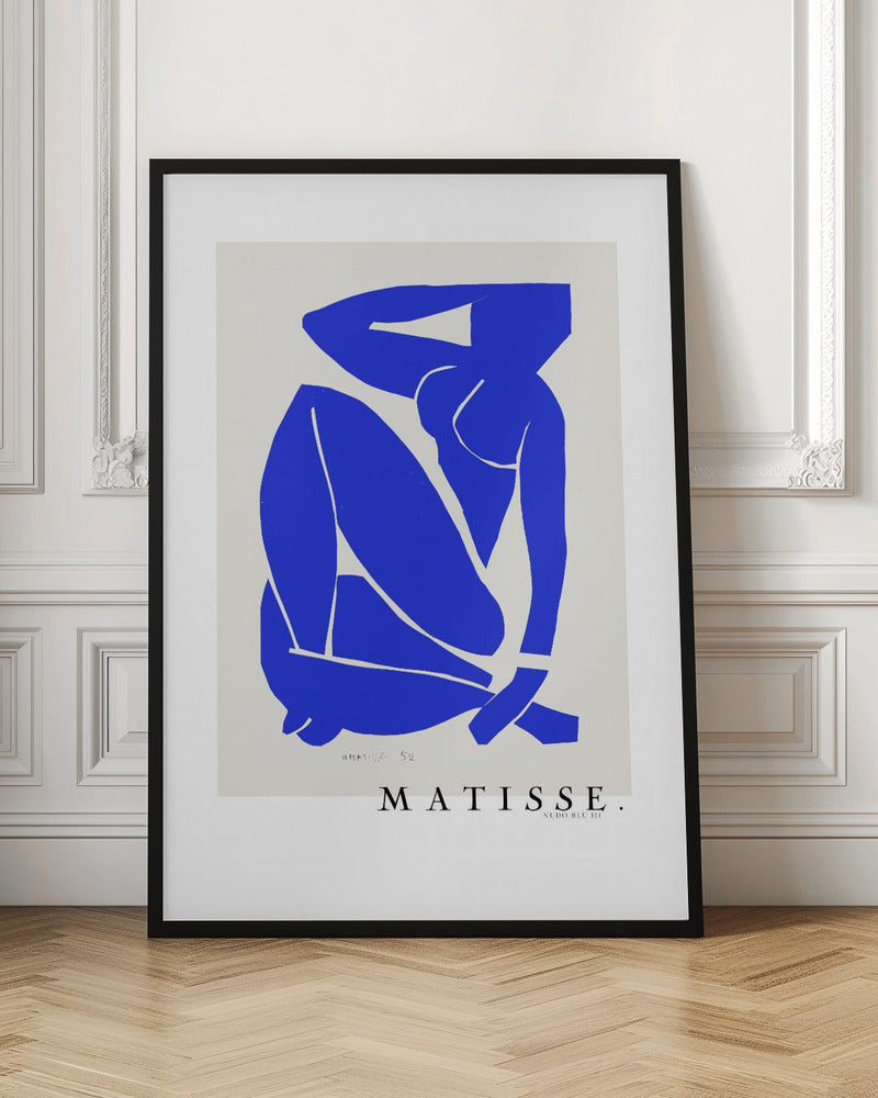 A framed art print of Henri Matisse's 'Blue Nude III', featuring a vibrant blue paper cut-out of a seated nude woman against an off-white background. Poster