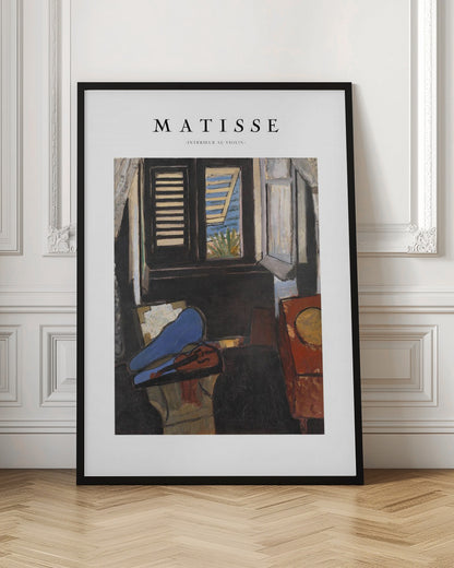 A framed poster of Henri Matisse's painting 'Intérieur au Violon'. The artwork depicts a dimly lit room with a violin resting on its open, vibrant blue case in the foreground. An open window in the background reveals a bright, sunny seascape. Poster