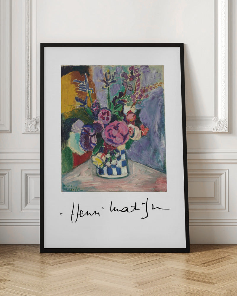A framed art print of a vibrant Henri Matisse painting. The still life features a bouquet of colorful pink, purple, and white flowers in a blue and white checkered vase, set against a multi-toned background. The artist's signature is displayed below the painting on the white mat. Print