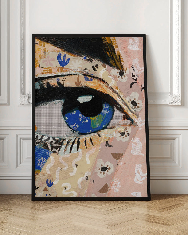 A vibrant mixed-media collage painting focusing on a large human eye. The iris is a deep blue filled with tiny white flower patterns, while the surrounding skin is a patchwork of pink and beige papers with various abstract and floral motifs. The eye is framed by thick black eyeliner. Wall Art