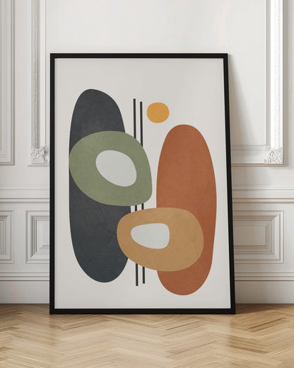 An abstract art print in a black frame, featuring a collection of overlapping organic shapes in muted earth tones. A large dark gray oval is on the left, next to a burnt orange oval on the right. In front of them are two ring-like shapes, one olive green and one light orange, both with off-white centers. A small yellow circle is near the top, and thin vertical black lines cut through the composition. The background is a soft off-white. Print