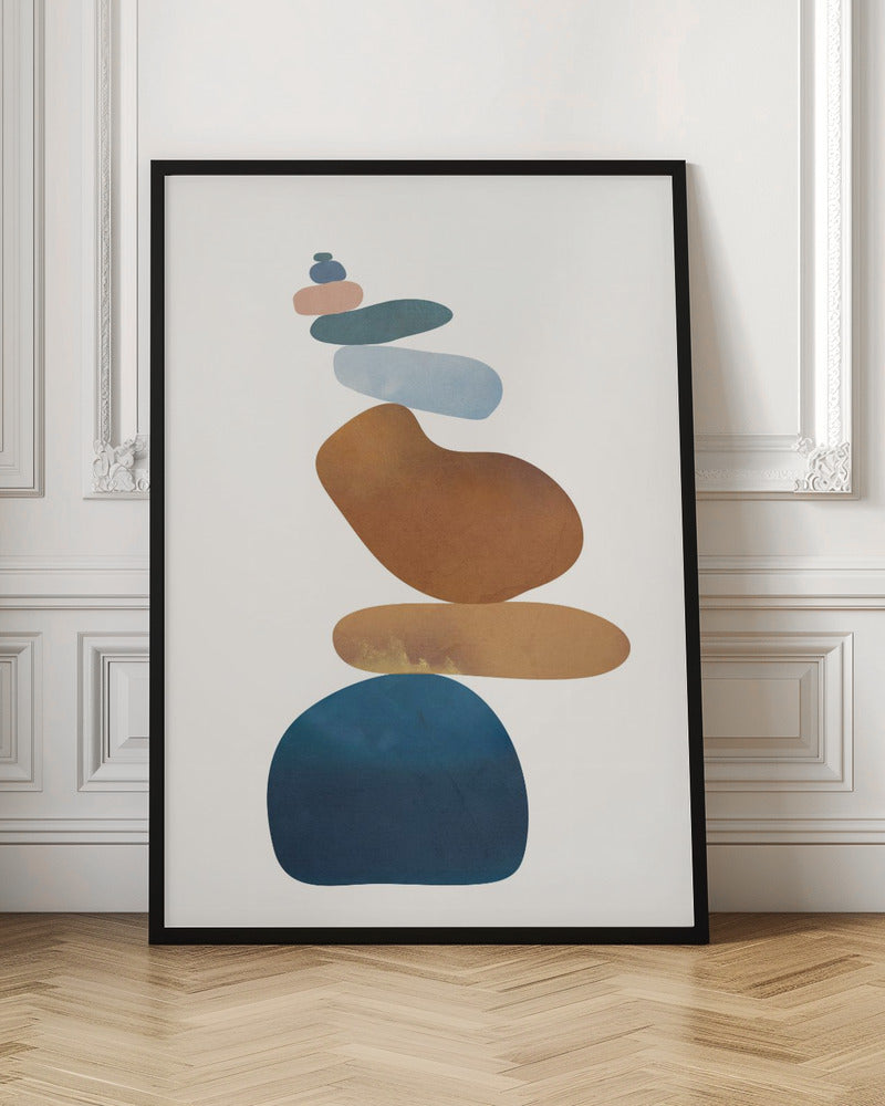 A minimalist abstract painting in a black frame, featuring a precarious stack of colorful, smooth, organic shapes resembling stones against a cream background. The colors range from a large dark blue at the base to brown, ochre, light blue, teal, and pink at the top. Poster