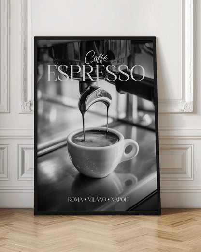 A black and white poster of an espresso machine pouring a fresh shot into a small white cup. The words 'Caffè ESPRESSO' are printed in elegant fonts at the top, and 'ROMA • MILANO • NAPOLI' at the bottom. Wall Art