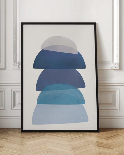 An abstract art print in a black frame, featuring a vertical stack of five semi-circular, dome-like shapes against an off-white background. The shapes are in various shades of blue and gray and have a translucent, overlapping quality, creating a sense of depth and balance. Artwork