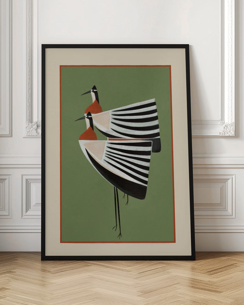A framed art print featuring two highly stylized birds standing against a solid sage green background. The birds have boat-shaped bodies with bold black and white stripes, orange chests, and long thin black legs and beaks. Wall Art