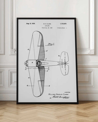 A framed black and white patent illustration for an airplane, dated August 6, 1929. The image shows a top-down schematic view of the aircraft, labeled as 'Fig. 1', with various parts numbered. Text at the top identifies the inventor W. D. Clark and the patent number. At the bottom, the inventor's full name and attorney's signature are visible. Print
