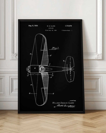 A vintage patent illustration for an airplane by W.D. Clark, dated August 6, 1929. The image is a white-on-black blueprint-style schematic showing a top-down view of the aircraft, complete with technical labels and signatures within a black frame. Artwork