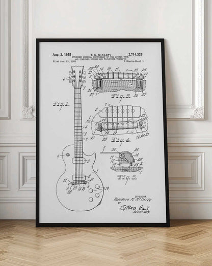 A framed black and white patent illustration for a stringed musical instrument, specifically an electric guitar, filed in 1953 by T. M. McCarty. The poster displays detailed schematic drawings of the guitar's body, neck, and close-ups of the combined bridge and tailpiece. Artwork