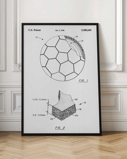 A framed black and white U.S. patent illustration, dated December 3, 1996, for a soccer ball. It features two figures: FIG. 1 shows the full ball with its iconic panel design and a cutaway view of its layers, and FIG. 2 shows a detailed cross-section of the ball's material. Artwork