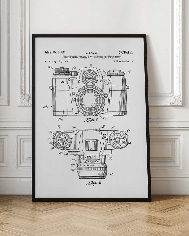 A framed black and white patent illustration of a vintage camera from 1962. It shows two detailed technical drawings, a front view and a top-down view, with numbered parts. Text at the top reads 'May 15, 1962', 'E. SAUER', and the patent number '3,034,411'. Wall Art