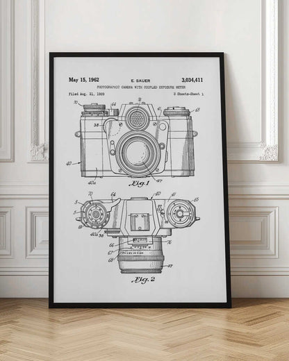 A framed black and white patent illustration of a vintage camera from 1962. It shows two detailed technical drawings, a front view and a top-down view, with numbered parts. Text at the top reads 'May 15, 1962', 'E. SAUER', and the patent number '3,034,411'. Wall Art