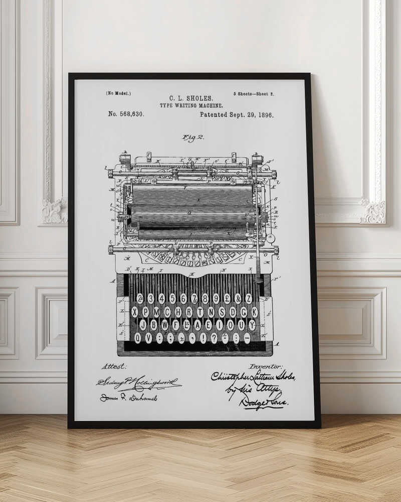A framed black and white patent illustration of a C. L. Sholes typewriter, patented September 29, 1896. The detailed schematic shows the front view of the machine, including its complex inner workings and an unconventional keyboard layout, with signatures below. Print