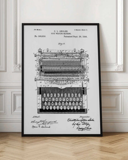 A framed black and white patent illustration of a C. L. Sholes typewriter, patented September 29, 1896. The detailed schematic shows the front view of the machine, including its complex inner workings and an unconventional keyboard layout, with signatures below. Print
