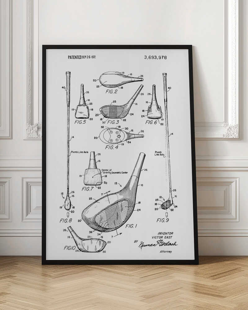 A framed black and white print of a 1972 patent for a golf club, showing detailed technical drawings and diagrams of the club head and shaft from multiple angles. Artwork