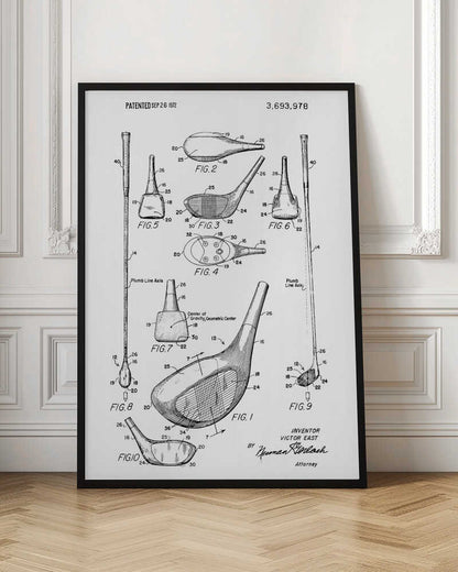 A framed black and white print of a 1972 patent for a golf club, showing detailed technical drawings and diagrams of the club head and shaft from multiple angles. Artwork