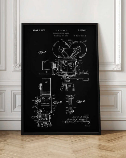 A framed vintage patent illustration for a cinematographic camera, presented as a white line drawing on a black background. The blueprint-style artwork shows detailed diagrams of a 1930s movie camera, complete with text from the original patent filing. Artwork
