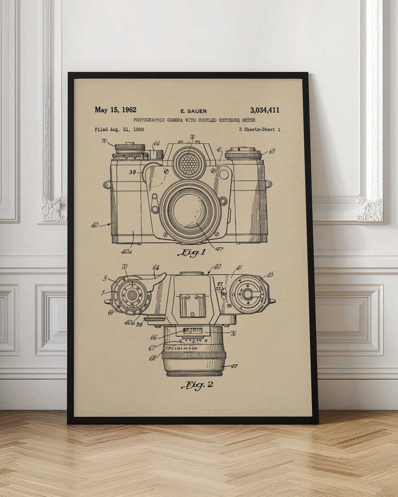 A framed vintage patent illustration from 1962 for a photographic camera with an exposure meter, showing detailed front and top-down technical drawings in black ink on aged beige paper. Decor