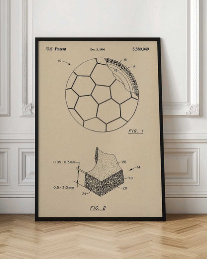 A framed vintage-style patent drawing of a soccer ball, U.S. Patent 5,580,049 from 1996. The poster displays two figures on a beige background: FIG. 1 shows the soccer ball with its hexagonal pattern and a cutaway view of its layers, while FIG. 2 provides a detailed cross-section of the ball's material. Wall Art
