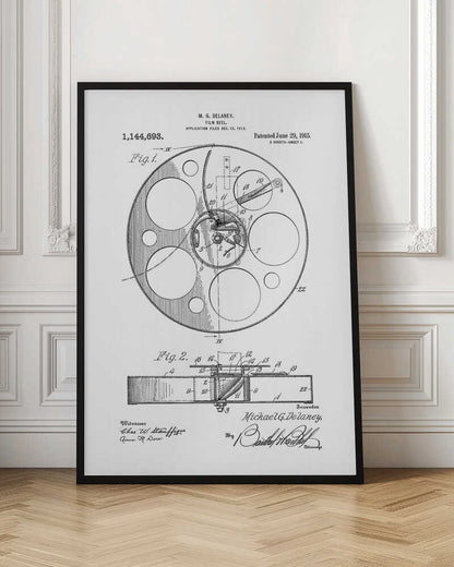 A framed black and white patent illustration for a film reel by M. G. Delaney, patented on June 29, 1915. The technical drawing shows a top view and a cross-section of the film reel, complete with part numbers, inventor's signature, and patent information. Poster