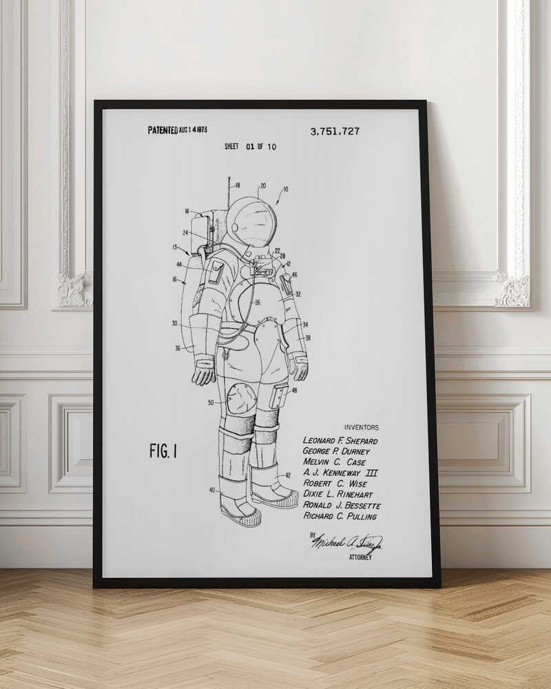 A framed black and white print of a United States patent document for a space suit, dated August 14, 1973. The print features a detailed technical line drawing of an astronaut in a full space suit, with various parts labeled with numbers. Text at the top indicates it is patent number 3,751,727, and at the bottom lists the inventors. Print