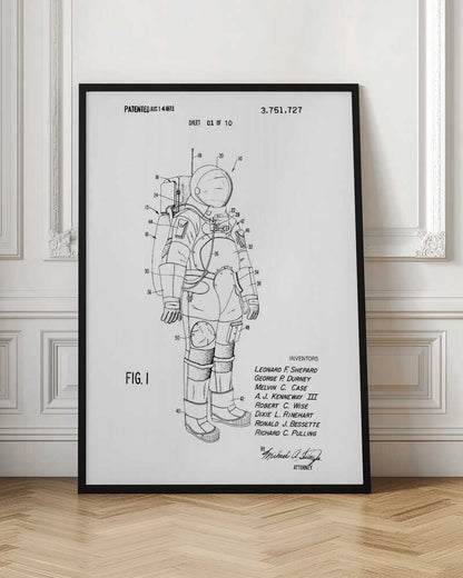 A framed black and white print of a United States patent document for a space suit, dated August 14, 1973. The print features a detailed technical line drawing of an astronaut in a full space suit, with various parts labeled with numbers. Text at the top indicates it is patent number 3,751,727, and at the bottom lists the inventors. Print
