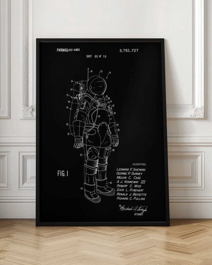 A framed patent illustration of an astronaut's spacesuit, depicted as a white line drawing on a black background. The technical schematic is labeled with various numbers and includes text like 'PATENTED AUG 14 1973', 'FIG. 1', and a list of inventors. Wall Art