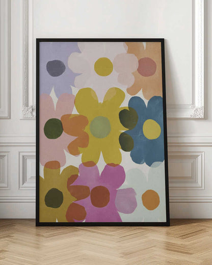 A colorful abstract painting of overlapping, stylized flowers in shades of yellow, blue, pink, orange, and purple. The simple, rounded flower shapes are semi-transparent, creating new colors where they overlap against a light background, all within a thin black frame. Decor