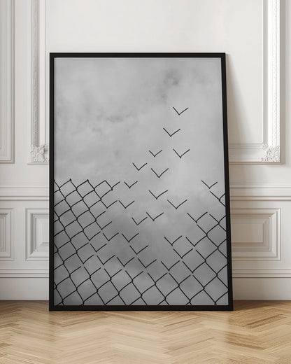 A conceptual black and white artwork showing a chain-link fence against a cloudy sky. A part of the fence is breaking apart, with the individual links transforming into a flock of birds flying away, symbolizing freedom and escape. Artwork