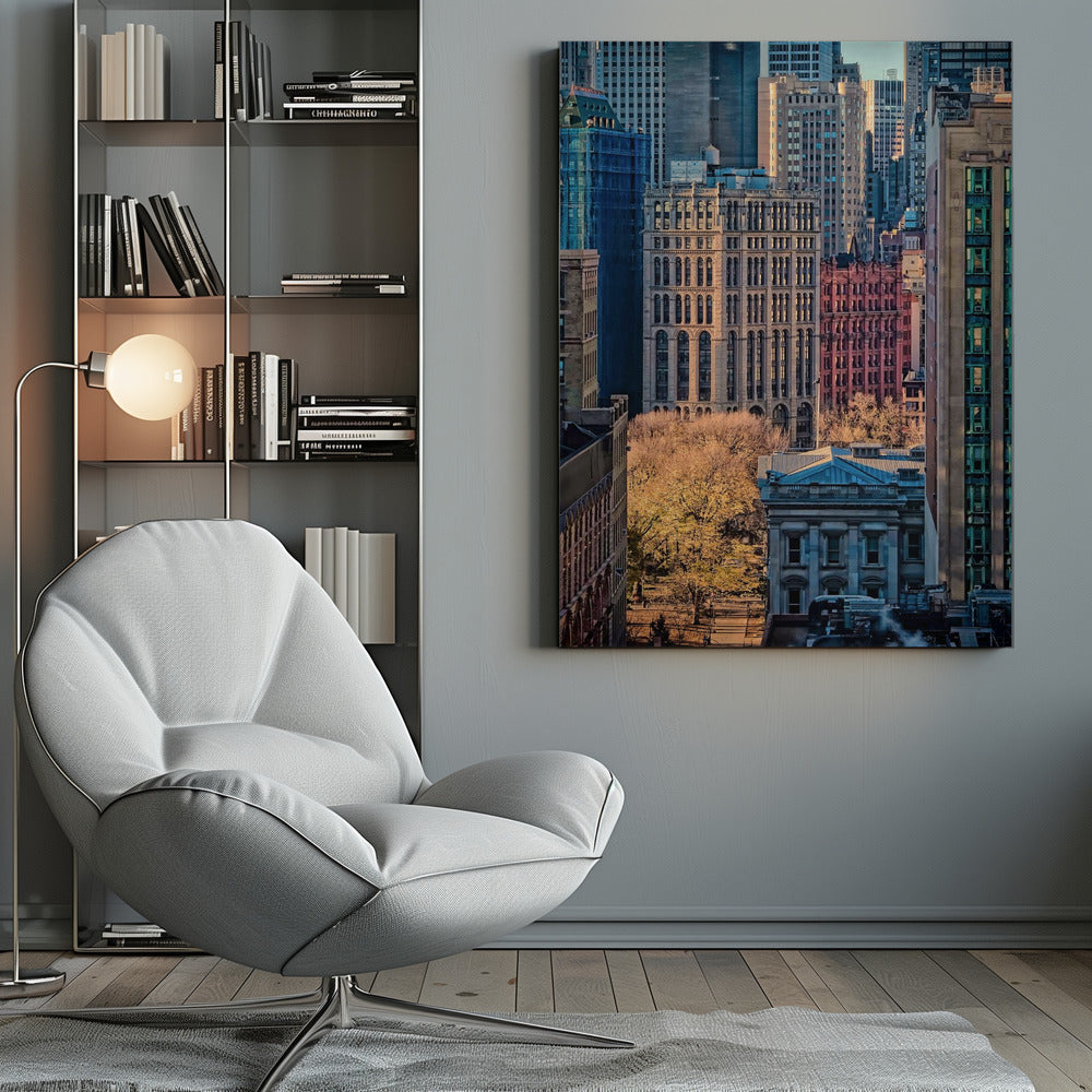 A high-angle view of a dense city skyline featuring a mix of old and new architectural styles. Golden light illuminates the autumn foliage of a park and the facades of several buildings, creating a warm contrast with the cool blue tones of the skyscrapers in the background. Decor