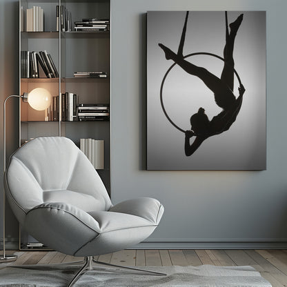A black silhouette of a graceful female acrobat in an inverted pose on a suspended aerial hoop, set against a light grey background. Print