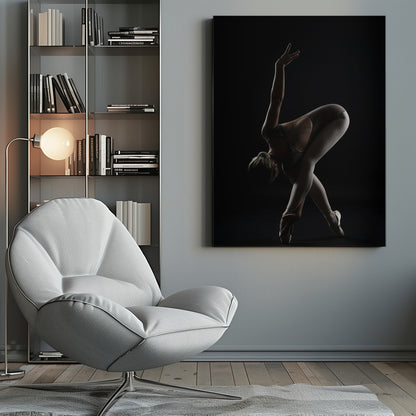 A dramatic studio photograph of a ballerina in a complex pose against a solid black background. Strong rim lighting highlights the graceful curves of her body as she bends forward with her legs crossed, one arm extended high and the other reaching towards her pointe shoes. Poster