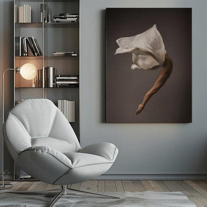 A minimalist fine art photograph of a dancer in mid-air against a solid grey background. The dancer's body is arched backwards, with a large piece of flowing white fabric enveloping their torso and creating a sense of dynamic, weightless motion. Only their muscular leg and pointed foot are clearly visible, emphasizing grace and form. Wall Art