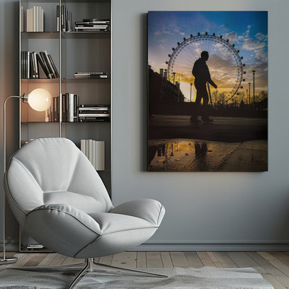 A low-angle shot of a person's silhouette walking past the London Eye at sunset, with the vibrant orange and blue sky reflected in a puddle in the foreground. Decor