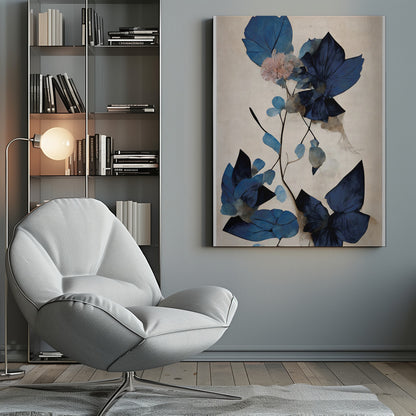 An abstract botanical artwork featuring large, angular leaves in various shades of deep and light blue. A single delicate pink flower blooms on a thin, dark stem against a textured, light cream background. The piece is displayed in a thin black frame. Artwork