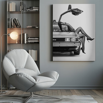 A black and white studio photograph of a DeLorean car with its gull-wing door open, featuring a woman's legs in black stockings and stilettos elegantly emerging from the passenger side. Decor
