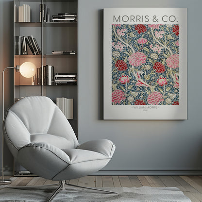 A framed art print of William Morris's 'Cray' pattern, featuring a dense floral design with large pink and red stylized flowers and foliage on a dark navy blue background. The text 'MORRIS & CO.' is above the pattern, and '- WILLIAM MORRIS - CRAY' is below. Artwork