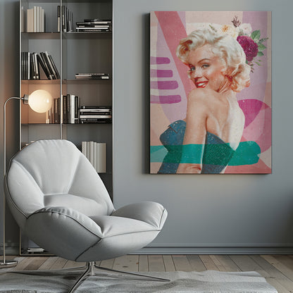 A framed, collage-style portrait of Marilyn Monroe smiling over her shoulder. Her classic blonde hair is adorned with pink, white, and burgundy flowers. She wears bright red lipstick and a blue strapless dress. The background is a textured composition of abstract shapes in shades of pink, purple, and beige, with modern teal and purple brushstrokes layered across the image. Decor