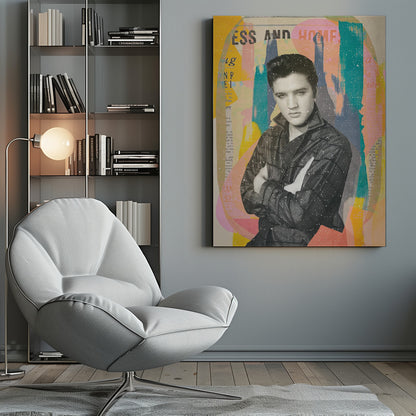 A pop art style collage of a young Elvis Presley. The portrait is in black and white, showing him with his arms crossed and a serious expression. The background is an abstract mix of colorful shapes in yellow, teal, orange, and pink, with fragments of newspaper text visible. The entire piece is covered in a light white speckle effect and is shown in a black frame. Print